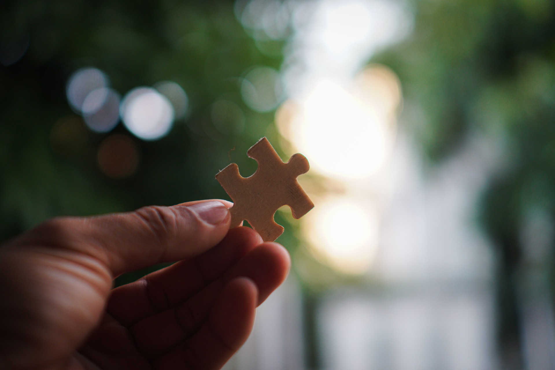 Hands and puzzles, important pieces of teamwork Teamwork concept